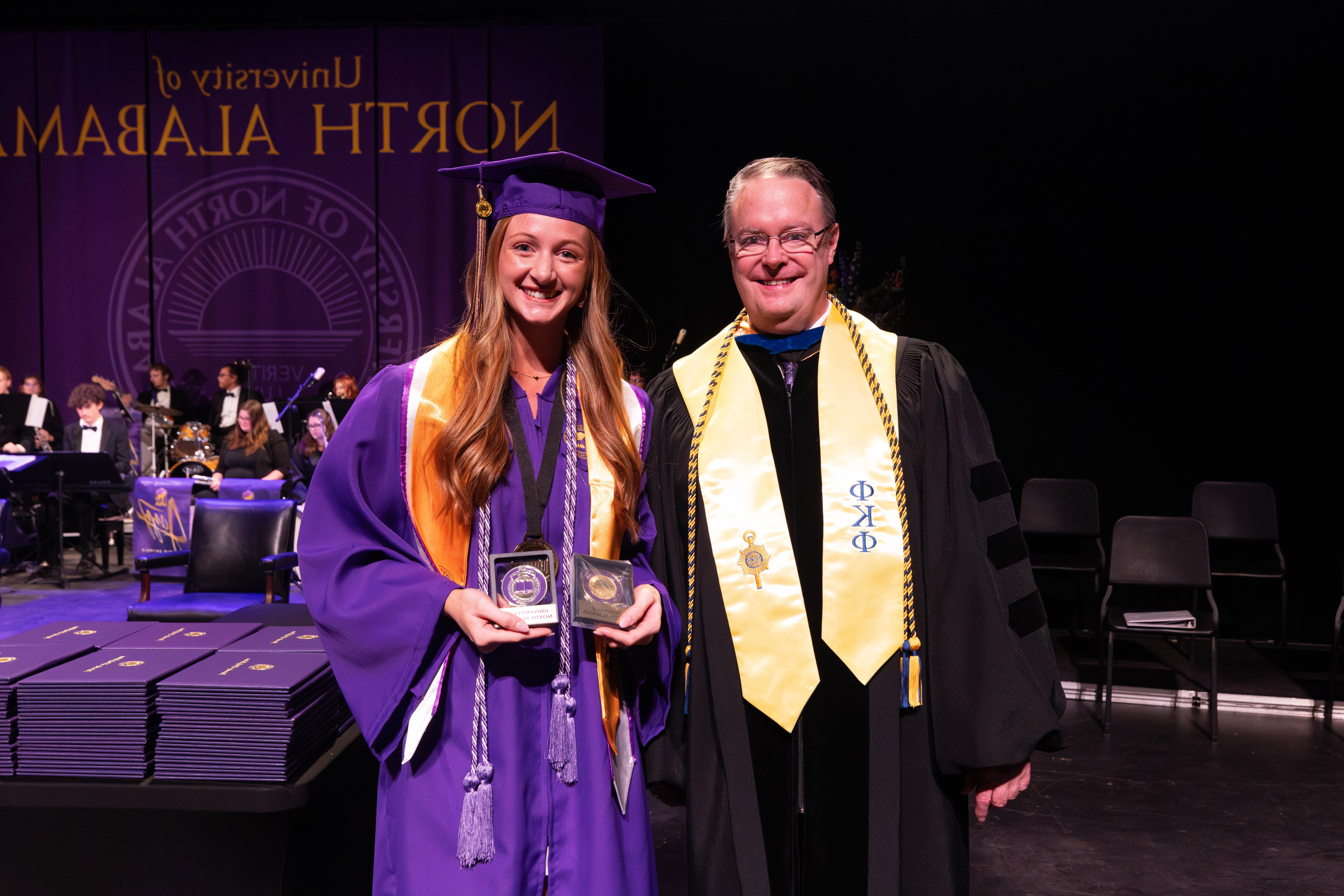 Alexis Marie Homer is one of the seven Keller Key recipients at the Fall 2024 commencement ceremonies at the University of North Alabama. Provost and Executive Vice President for Academic Affairs Dr. Brien Smith presented her with her award.